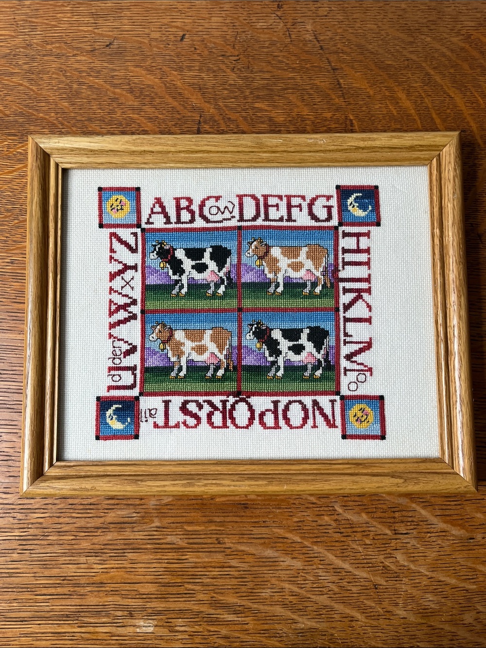 Framed Finished Cross-Stitch Alphabet with Cows - Red, Green, Black, Brown